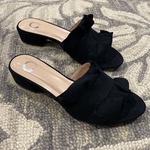 Brand new in the box. Black ruffle slide. Low heel